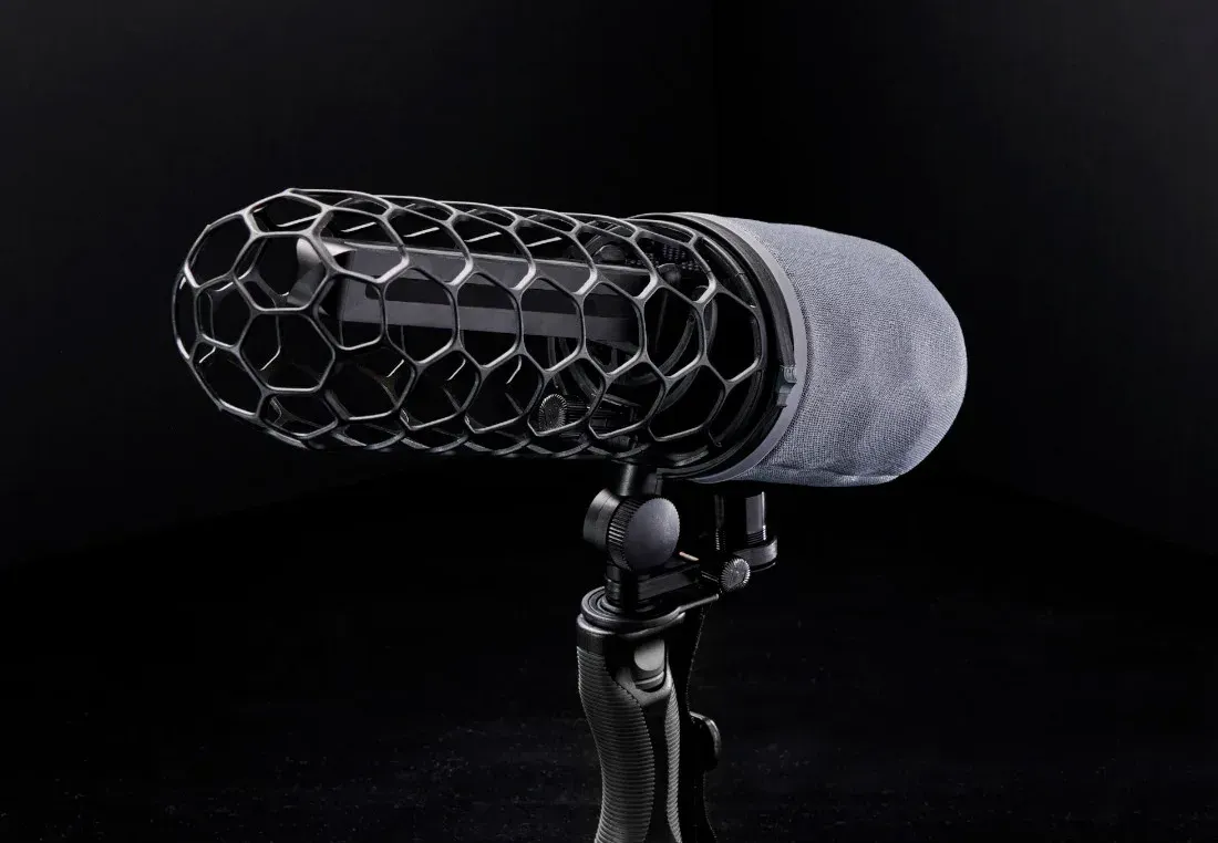 Konos microphone mounted inside a Rycote Nano Shield windshield on a pistol grip.